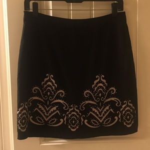 Laser-cut detailed mini skirt